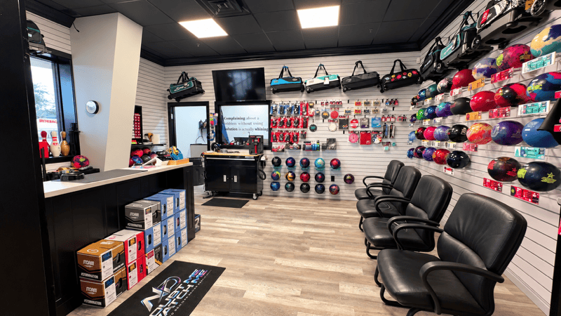 Inside the No Doubt Bowling Performance pro shop at Rowlett Bowl-A-Rama, with bowling balls, bags and a drilling counter