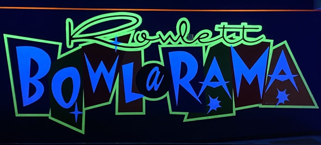 Rowlett Bowl-A-Rama neon sign glowing under black light
