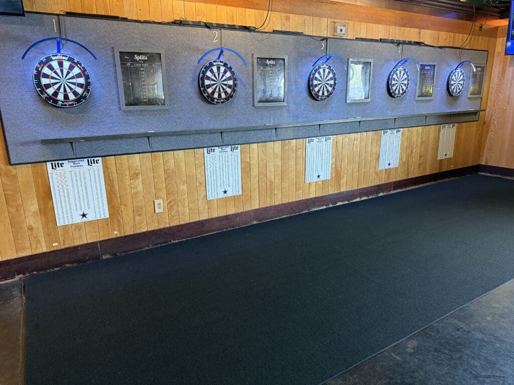 Dart boards lined up along the wall at Splits Sports Bar & Grill