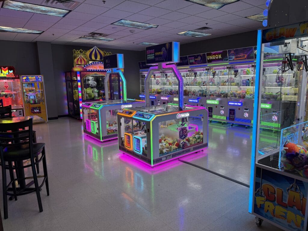 Rows of crane and claw machines in the claw room
