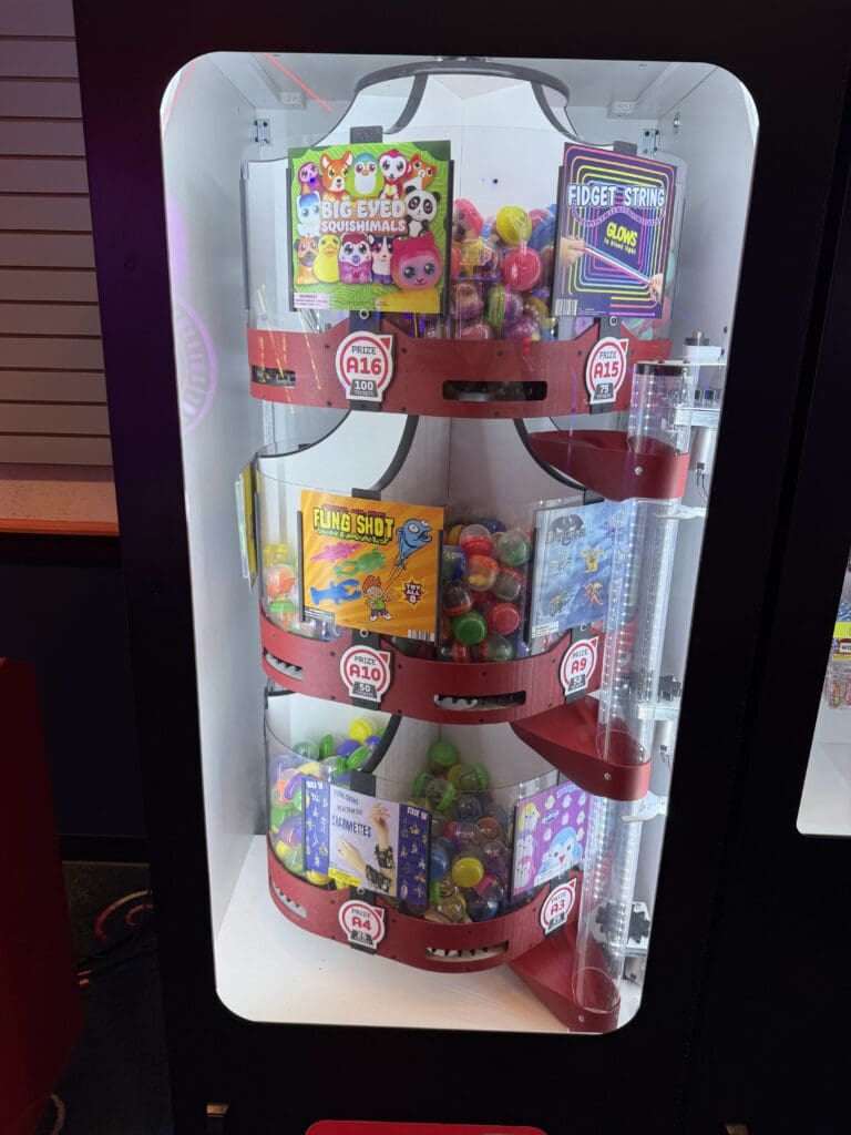 Prize machine filled with toys and treats in the arcade